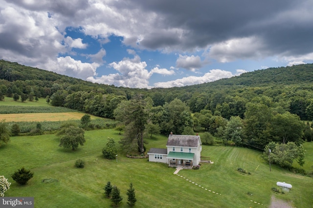 bird's eye view with a rural view and a view of trees