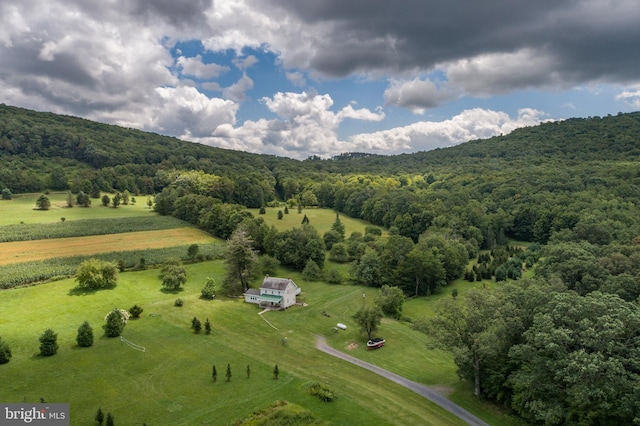 birds eye view of property with a rural view