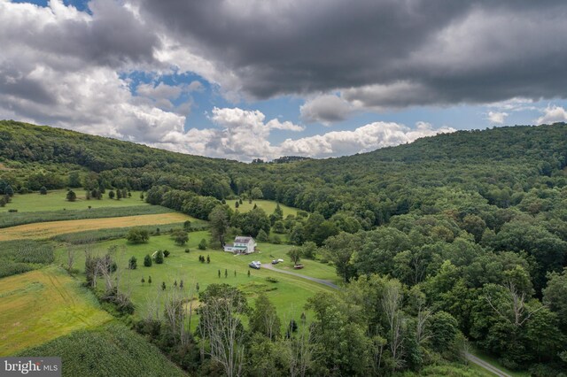 birds eye view of property with a rural view