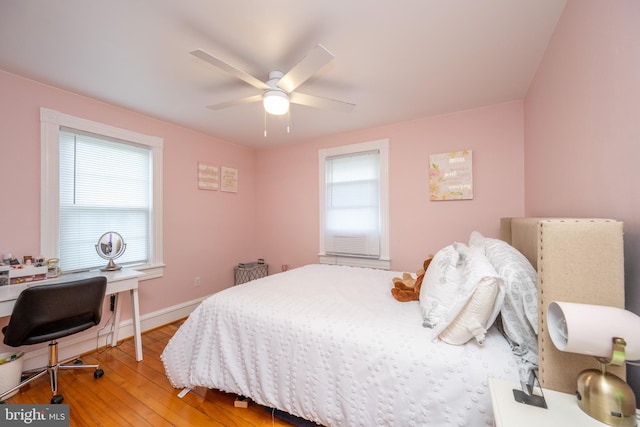 bedroom featuring ceiling fan, wood finished floors, and baseboards