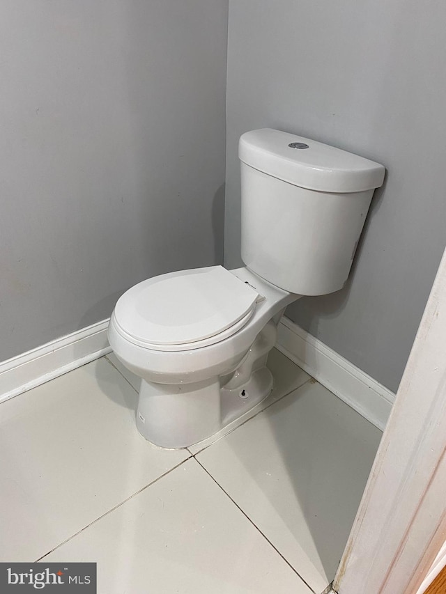 bathroom featuring toilet and tile patterned floors