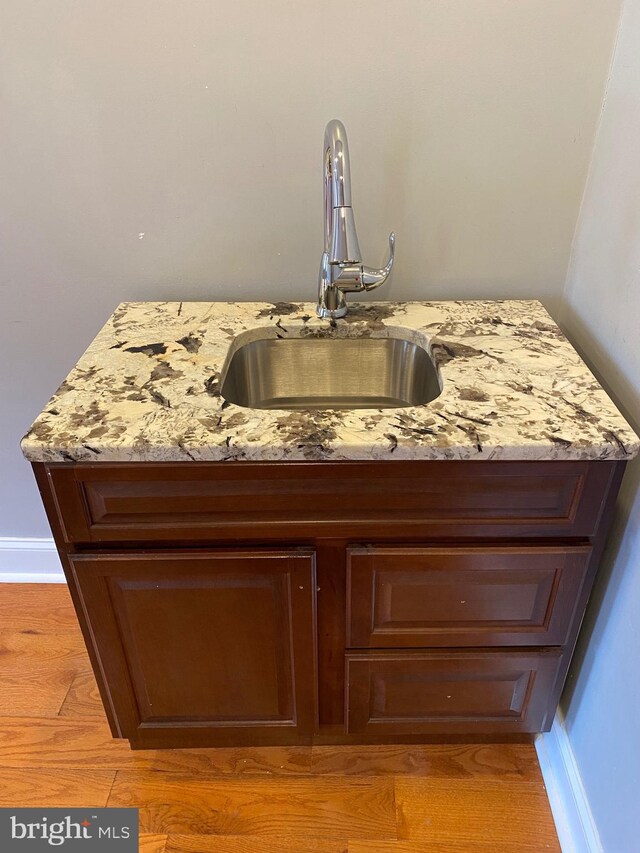 bathroom with tile patterned floors and vanity