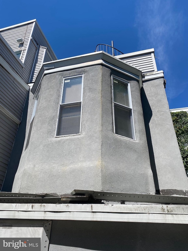 view of property exterior with stucco siding