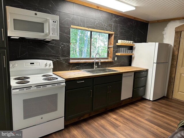 kitchen featuring wooden counters, dark hardwood / wood-style floors, decorative backsplash, sink, and white appliances