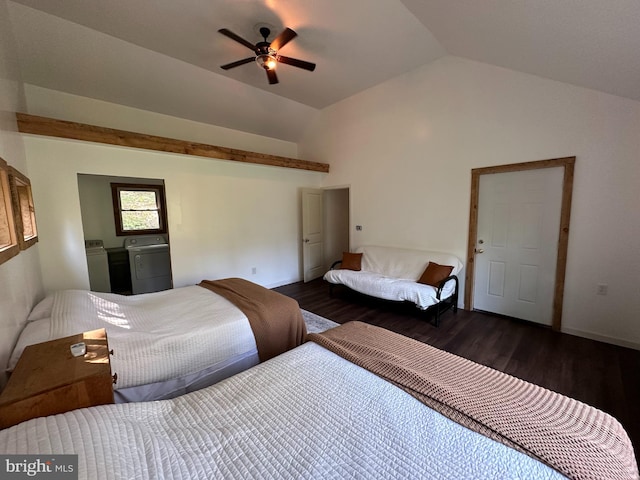 bedroom featuring dark wood-type flooring, ceiling fan, washer and dryer, and vaulted ceiling