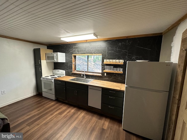 kitchen featuring ornamental molding, sink, white appliances, and dark hardwood / wood-style floors