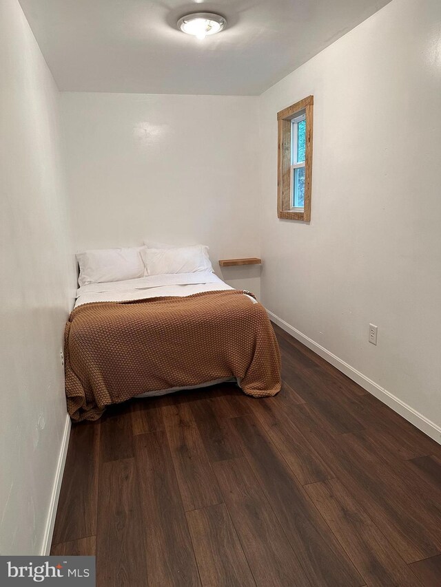 bedroom with wood-type flooring