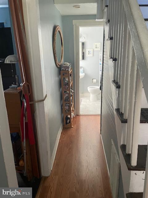 hallway featuring wood-type flooring