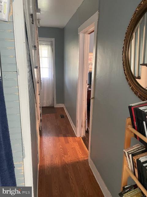 hallway featuring dark wood-type flooring