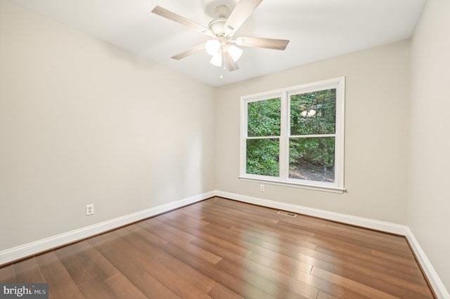 empty room featuring wood-type flooring and ceiling fan