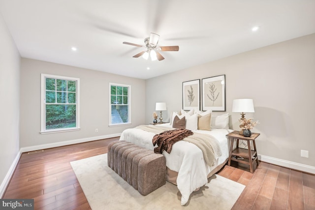 bedroom with light wood-type flooring and ceiling fan