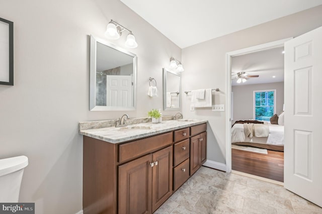 bathroom featuring ceiling fan, vanity, and toilet