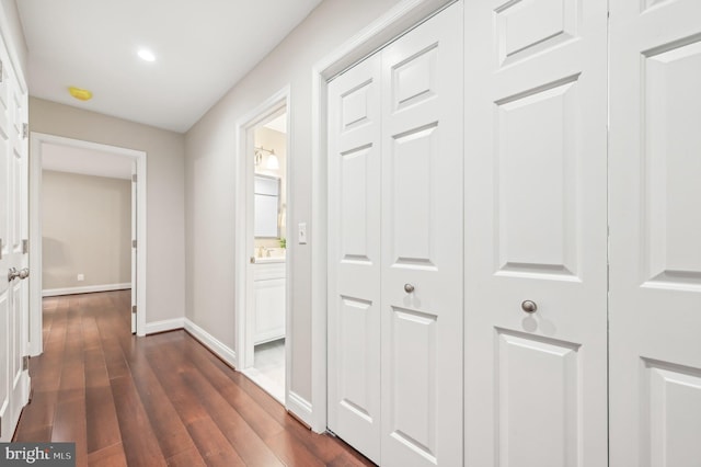 corridor featuring dark hardwood / wood-style floors