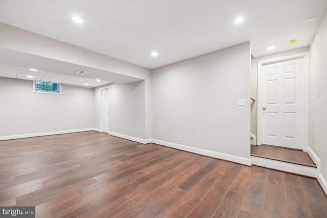 basement featuring dark hardwood / wood-style floors