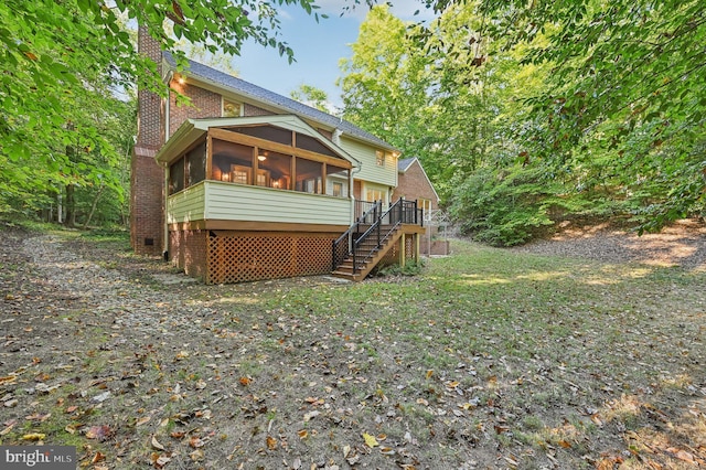 rear view of house with a sunroom