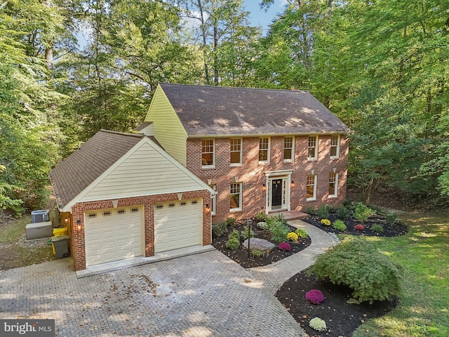 colonial-style house featuring a garage