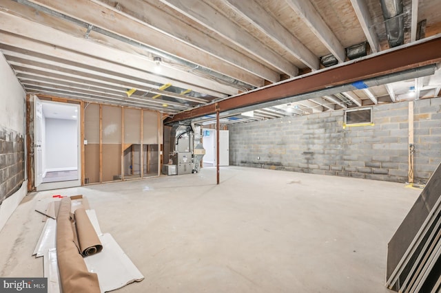 basement featuring heating unit