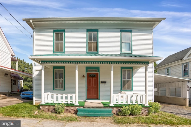 view of front of house featuring covered porch and metal roof