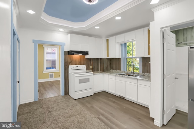 kitchen featuring sink, white range with electric cooktop, white cabinetry, and light hardwood / wood-style floors