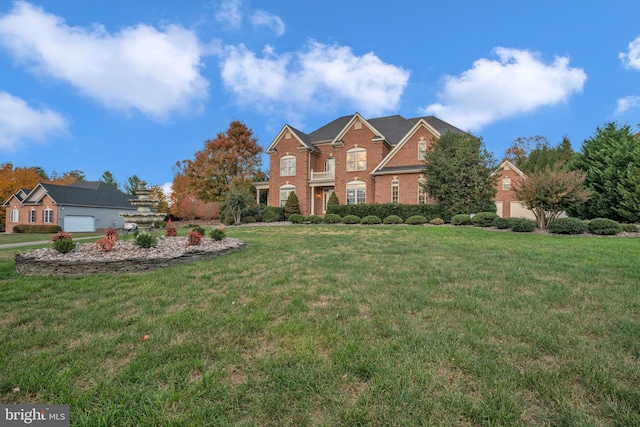 view of front of property with a garage and a front yard