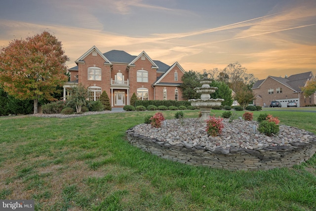 view of front of property with a yard