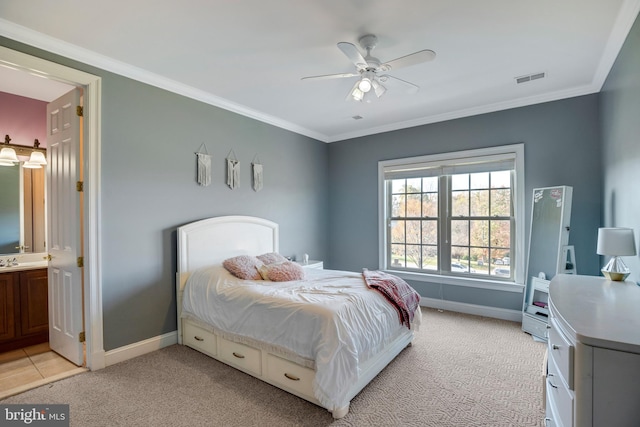 carpeted bedroom featuring ceiling fan, connected bathroom, and crown molding