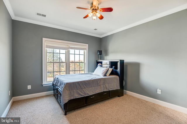 bedroom featuring light colored carpet, ceiling fan, and crown molding