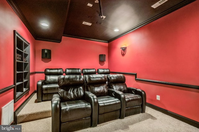 cinema room featuring carpet flooring and crown molding