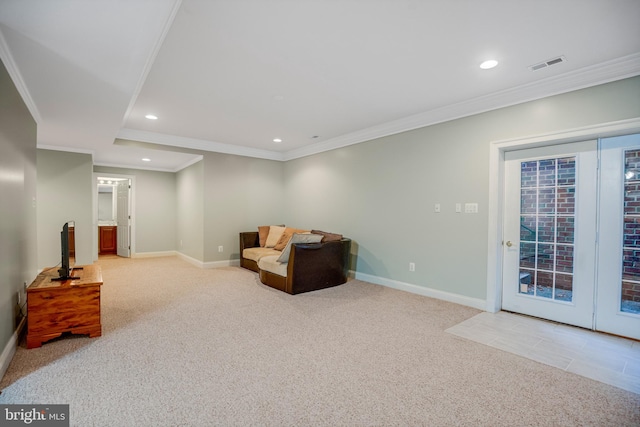 sitting room with light carpet and crown molding