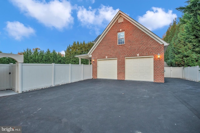 view of side of property featuring a garage