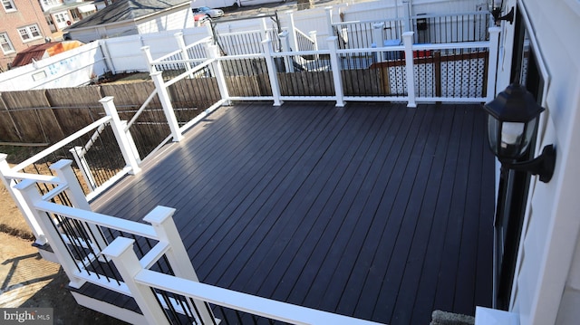 wooden deck featuring fence