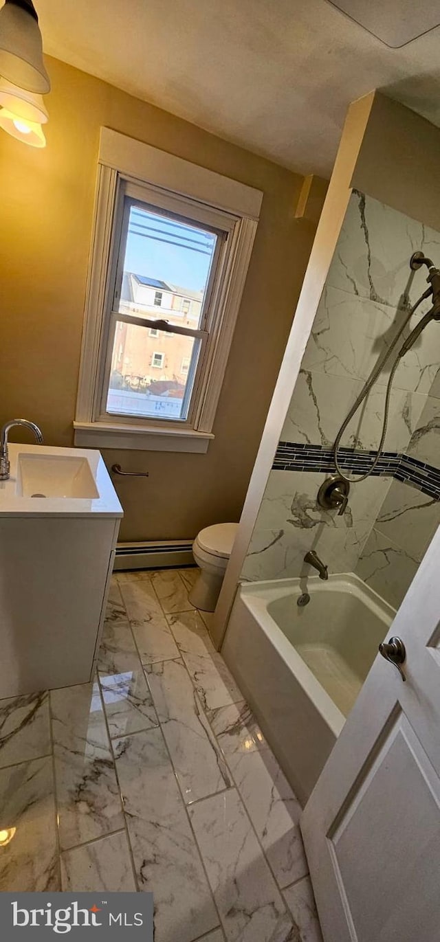 full bathroom with vanity, bathtub / shower combination, toilet, marble finish floor, and baseboard heating