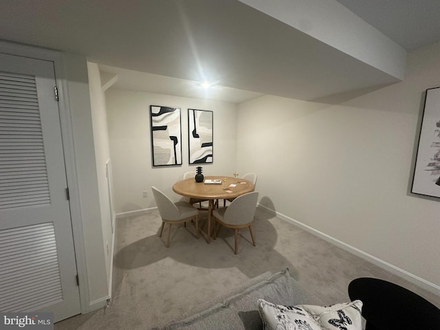 view of carpeted dining area