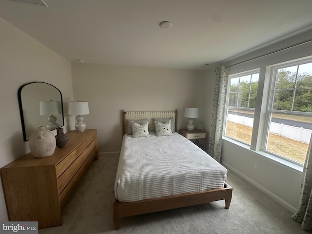 carpeted bedroom featuring vaulted ceiling