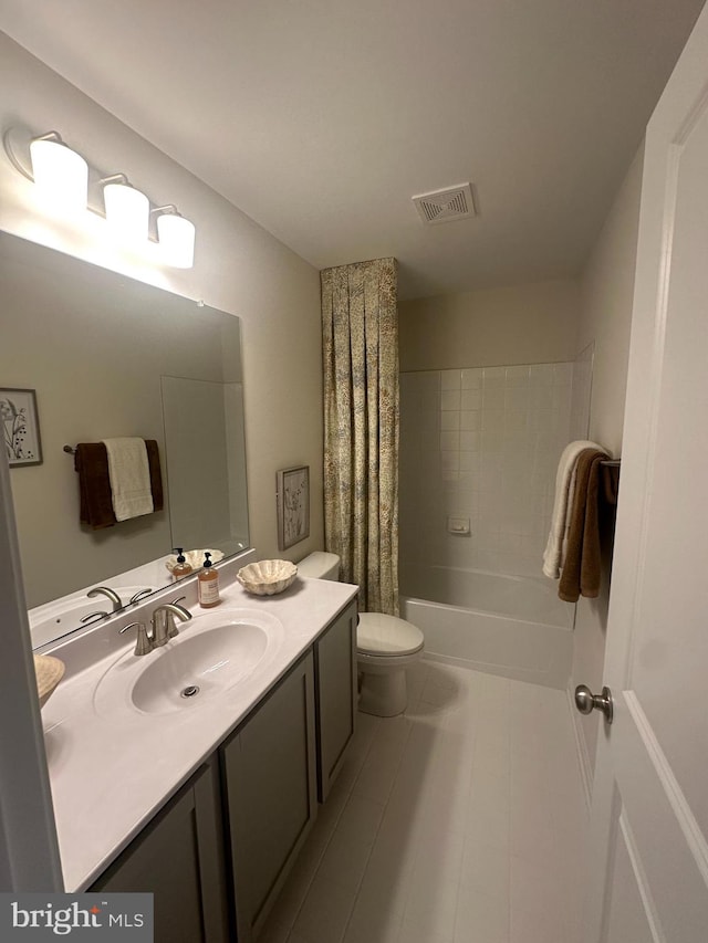 full bathroom featuring tile patterned floors, vanity, toilet, and shower / bath combo with shower curtain