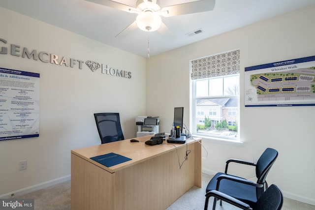 home office featuring ceiling fan and light colored carpet