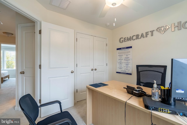 office area with ceiling fan and light colored carpet