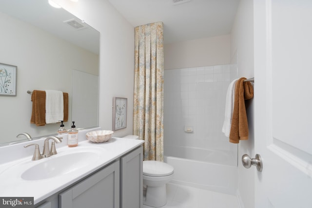 full bathroom featuring tile patterned floors, vanity, toilet, and shower / bath combo with shower curtain