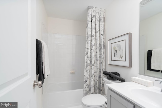 full bathroom featuring vanity, toilet, and shower / tub combo with curtain