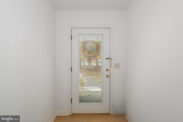 entryway with light hardwood / wood-style flooring