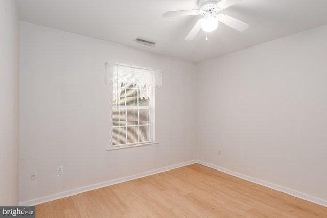 empty room featuring ceiling fan and light hardwood / wood-style floors