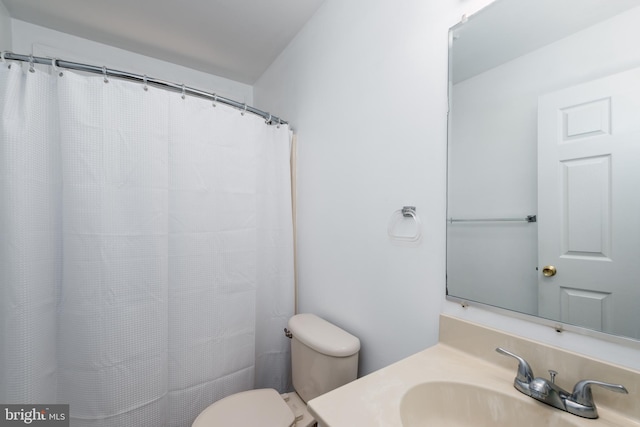 bathroom with toilet and vanity