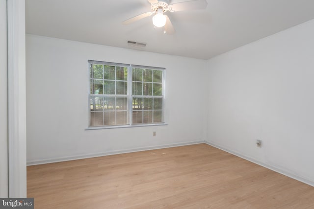 empty room featuring ceiling fan and light hardwood / wood-style floors