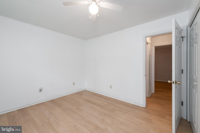 unfurnished room with ceiling fan and light hardwood / wood-style floors