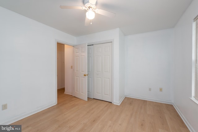 unfurnished bedroom featuring a closet, ceiling fan, and light hardwood / wood-style floors