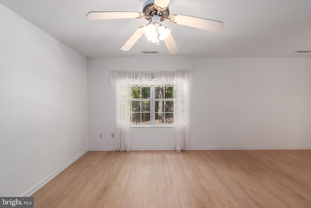 spare room with ceiling fan and light hardwood / wood-style floors