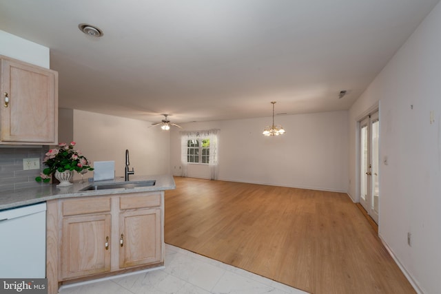 kitchen featuring dishwasher, light hardwood / wood-style flooring, ceiling fan with notable chandelier, sink, and light brown cabinets