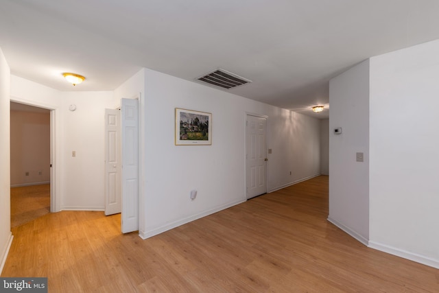 unfurnished room featuring light hardwood / wood-style floors