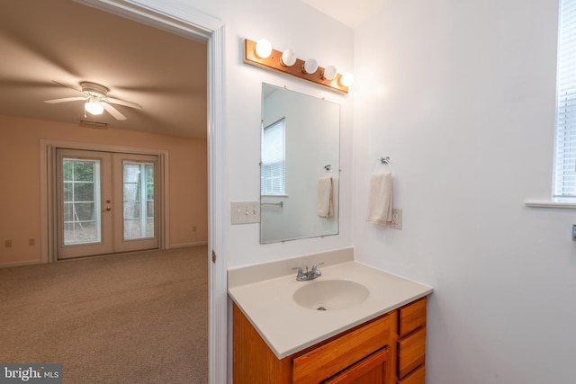 bathroom with vanity, french doors, and ceiling fan