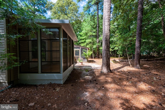 view of yard featuring a sunroom